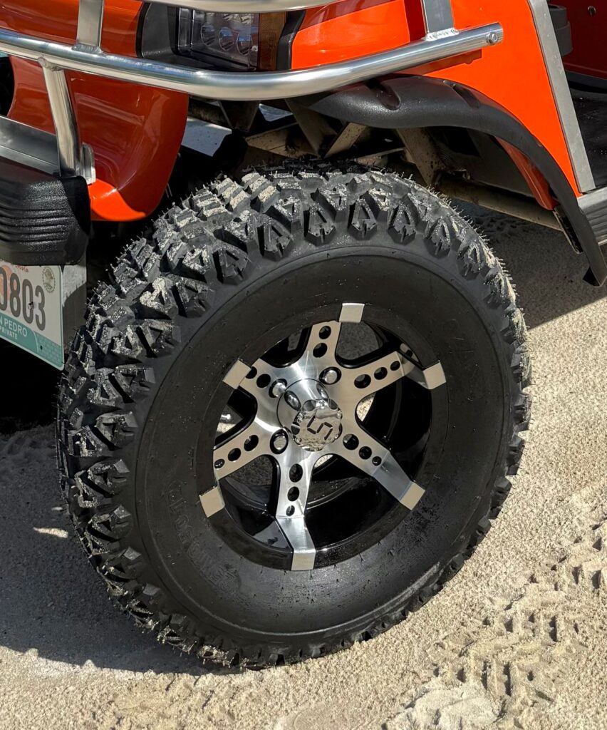 Golf cart with big tires for comfortable island driving in San Pedro, Belize